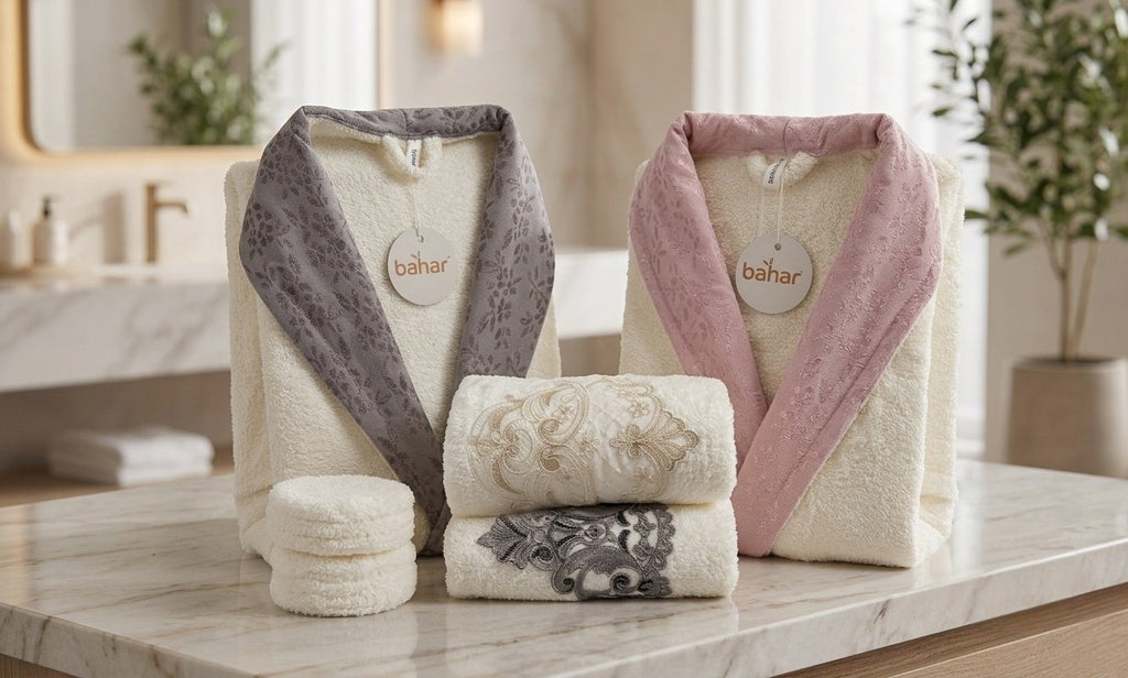 Bahar double bathrobe set with gray and pink satin collars, displayed with two embroidered towels
